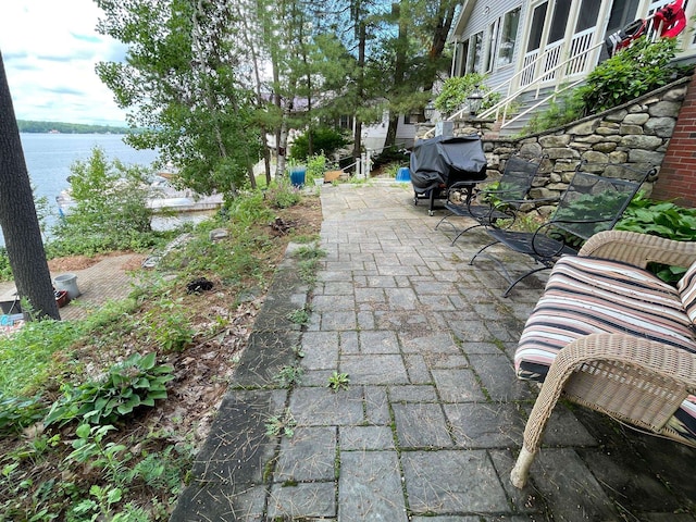 view of patio / terrace featuring a water view