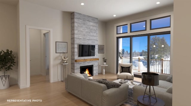 living room featuring light hardwood / wood-style floors and a fireplace