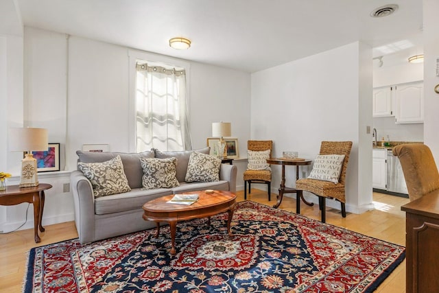 living room with light hardwood / wood-style floors