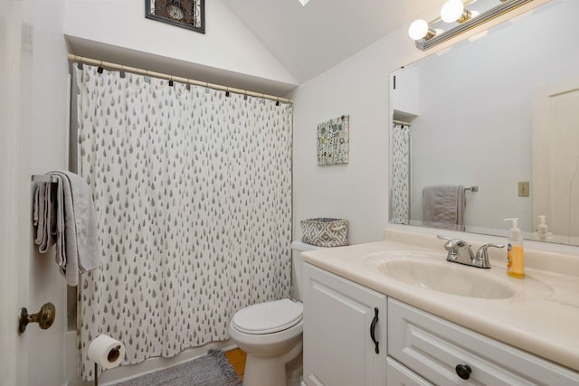 bathroom with vaulted ceiling, oversized vanity, and toilet