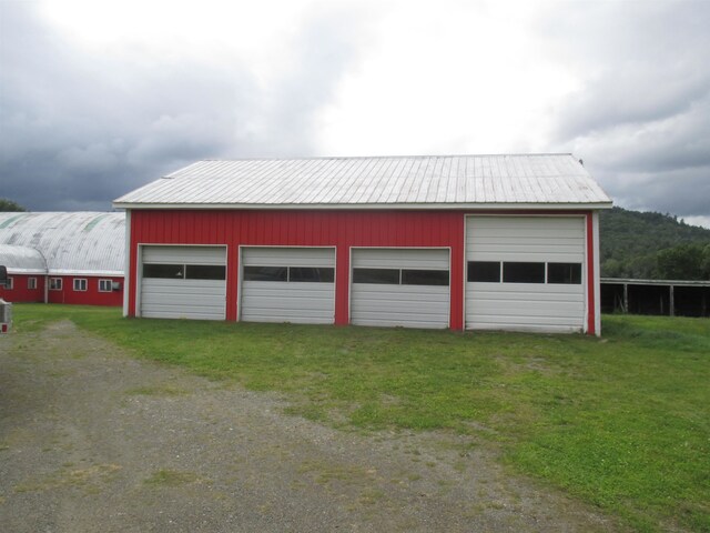 garage with a lawn