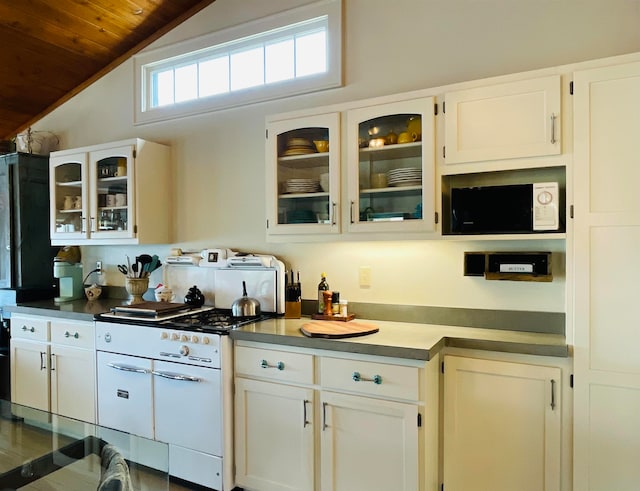 43 Jackson Lodge Rd, Canaan, VT 05903 - kitchen with white cabinets, wooden ceiling, white microwave, and vaulted ceiling