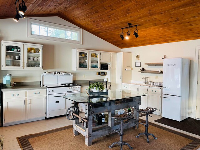 43 Jackson Lodge Rd, Canaan, VT 05903 - kitchen featuring white cabinets, wooden ceiling, white appliances, and lofted ceiling