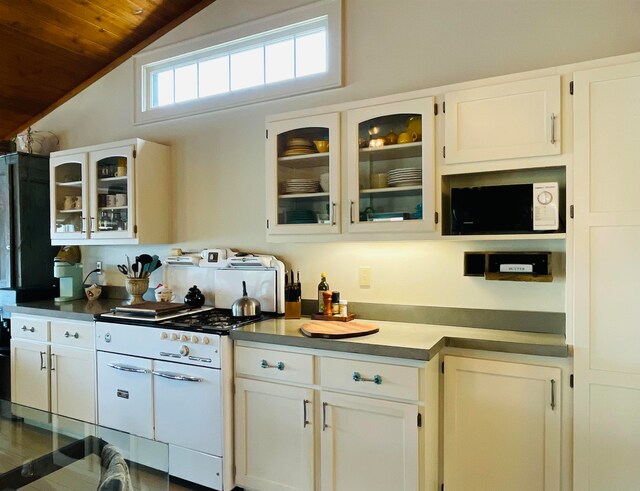 43 Jackson Lodge Rd, Canaan, VT 05903 - kitchen with lofted ceiling, white cabinetry, wood ceiling, and white microwave