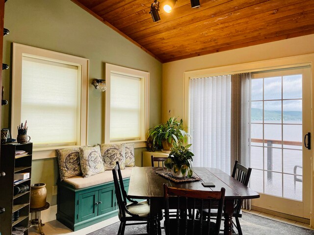 43 Jackson Lodge Rd, Canaan, VT 05903 - dining area featuring light carpet, a water view, wooden ceiling, and vaulted ceiling