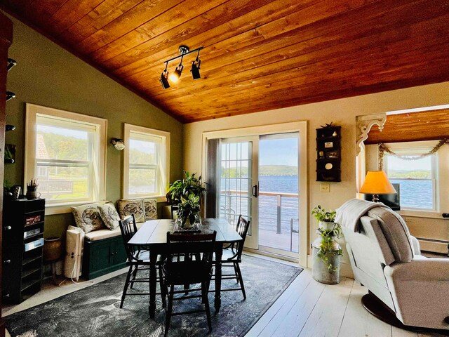 43 Jackson Lodge Rd, Canaan, VT 05903 - dining area featuring a baseboard radiator, a water view, wood-type flooring, lofted ceiling, and wood ceiling