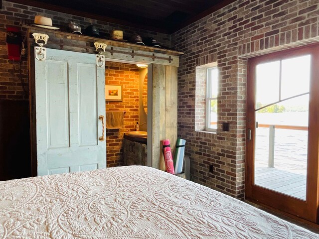 43 Jackson Lodge Rd, Canaan, VT 05903 - unfurnished bedroom with brick wall and access to outside