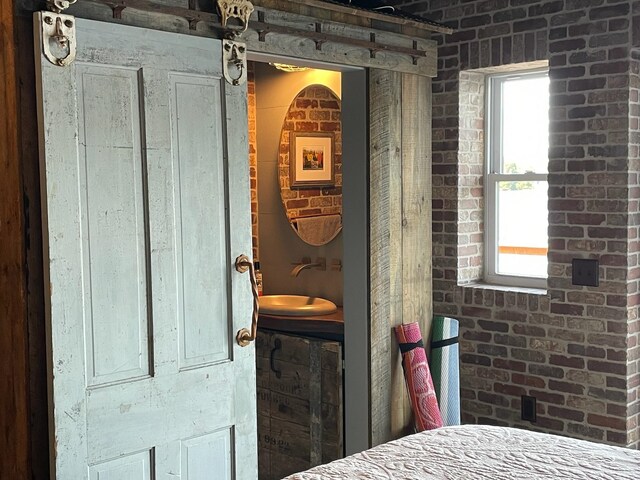 43 Jackson Lodge Rd, Canaan, VT 05903 - bedroom with brick wall and sink