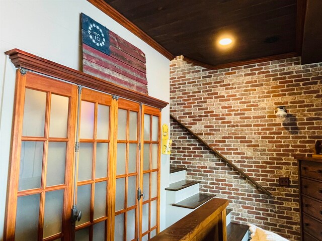 43 Jackson Lodge Rd, Canaan, VT 05903 - stairway with brick wall and crown molding
