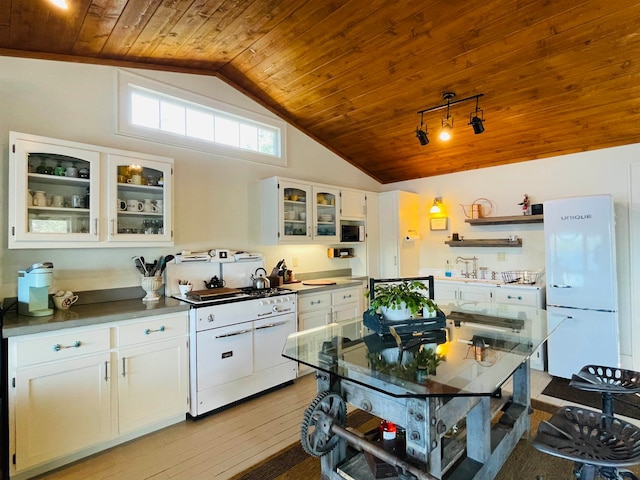 43 Jackson Lodge Rd, Canaan, VT 05903 - kitchen with lofted ceiling, white appliances, wooden ceiling, and white cabinets