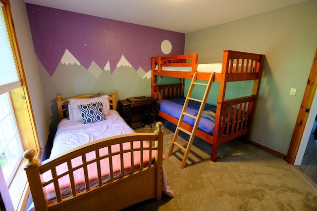 bedroom with carpet flooring and baseboards