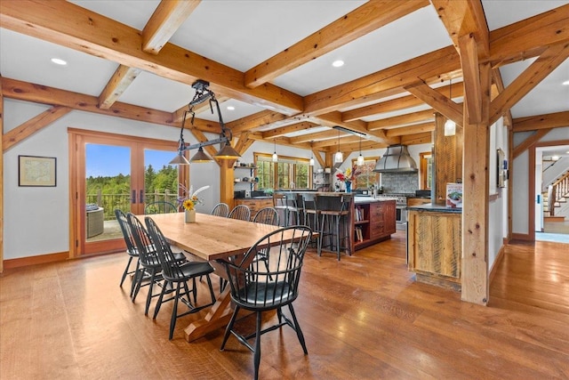 dining room featuring beam ceiling, french doors, and hardwood / wood-style floors