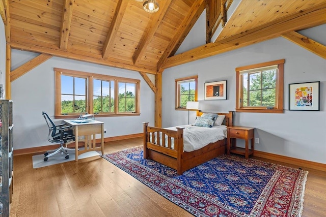 bedroom with multiple windows, wood ceiling, vaulted ceiling with beams, and light wood-type flooring