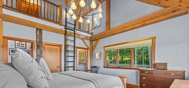 bedroom with a chandelier and a high ceiling