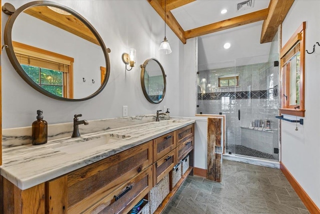 bathroom featuring double vanity, tile flooring, a shower with shower door, and beamed ceiling