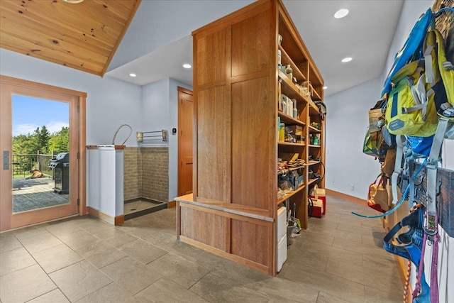 interior space with vaulted ceiling, light tile floors, and wooden ceiling