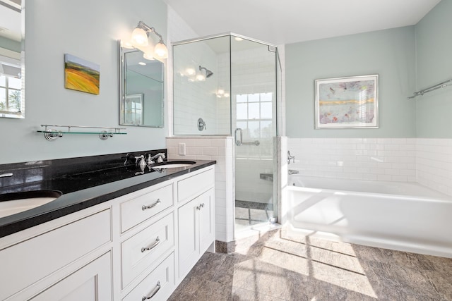 bathroom with vanity and separate shower and tub