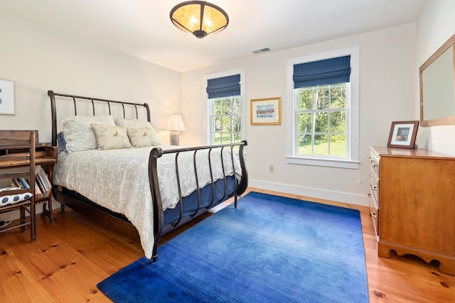 bedroom with wood-type flooring