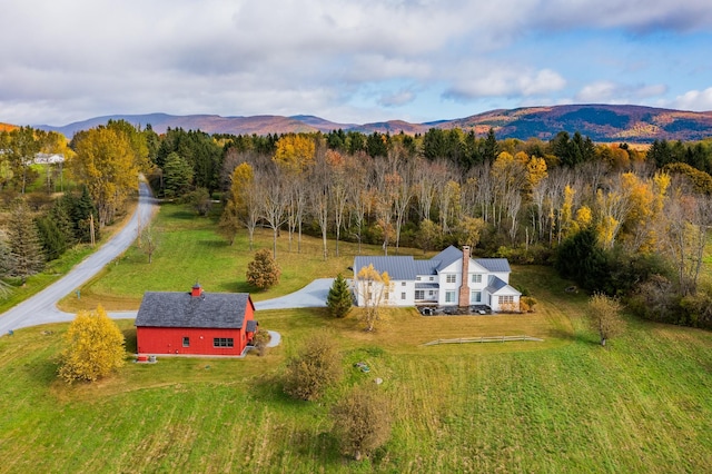 birds eye view of property featuring a mountain view