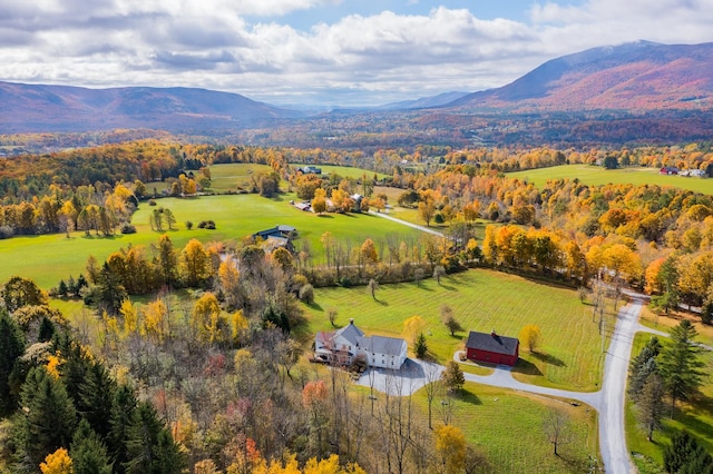 drone / aerial view featuring a mountain view and a rural view