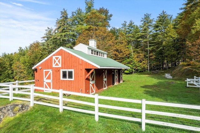 view of outdoor structure with a lawn