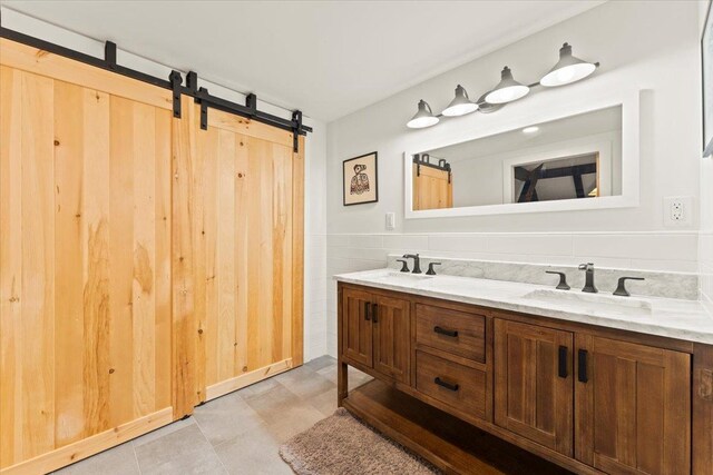 bathroom with double vanity and tile flooring