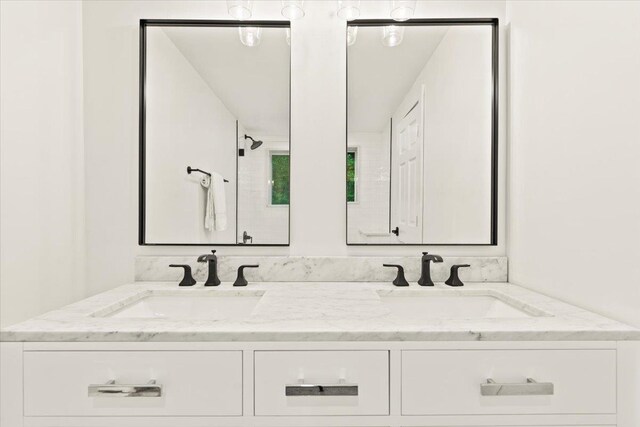 bathroom with dual bowl vanity