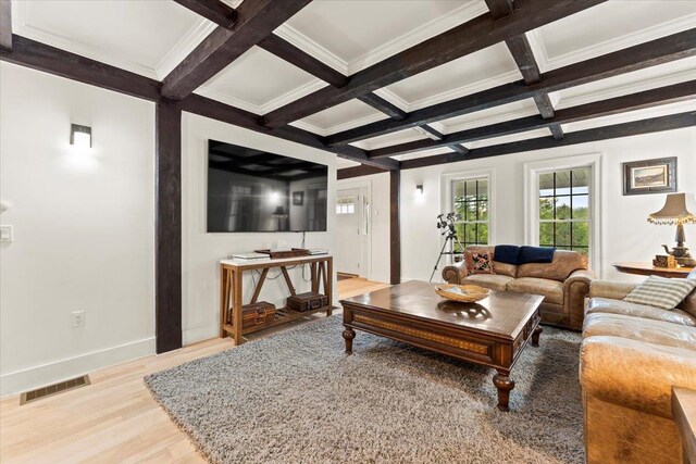 living room featuring coffered ceiling, beamed ceiling, and light hardwood / wood-style floors