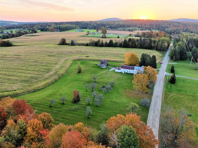 aerial view at dusk featuring a rural view