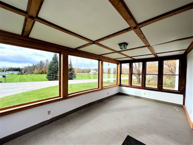 unfurnished sunroom with coffered ceiling