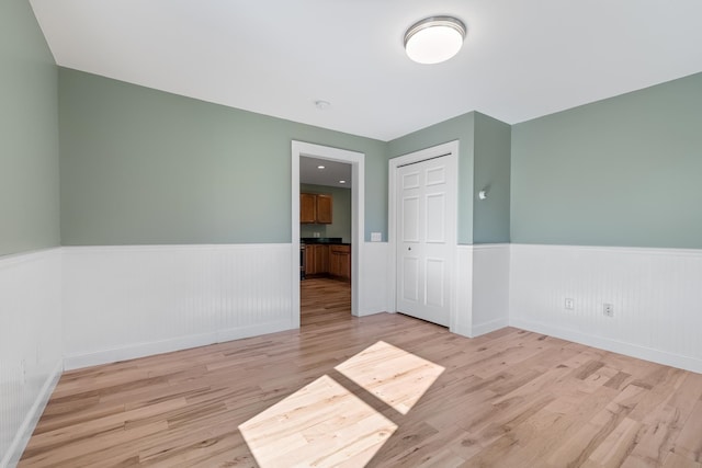 spare room featuring light hardwood / wood-style floors