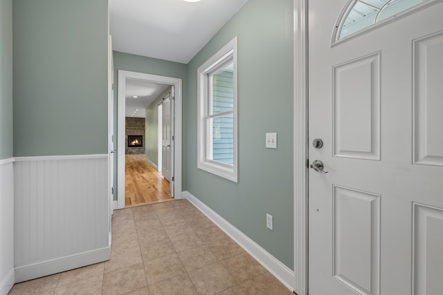 hall featuring light hardwood / wood-style flooring and a wealth of natural light