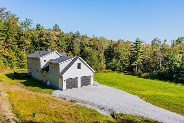 exterior space with a front lawn and a garage