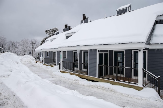 view of snow covered property