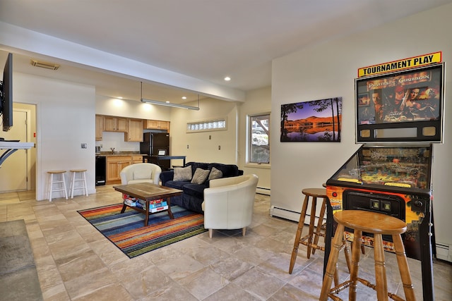 tiled living room featuring a baseboard radiator