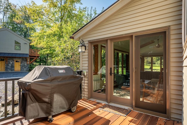 wooden terrace with a grill