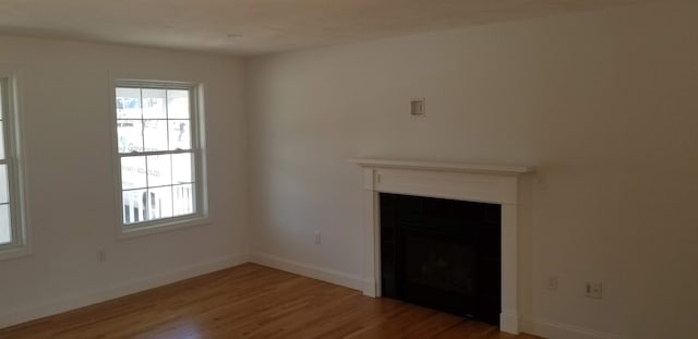 unfurnished living room featuring hardwood / wood-style floors