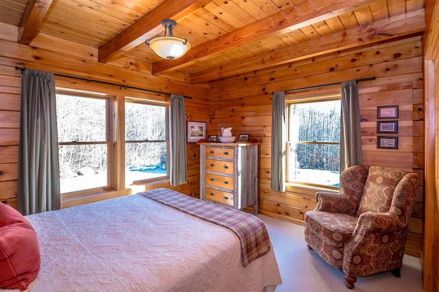 carpeted bedroom featuring beamed ceiling, wooden ceiling, multiple windows, and wood walls