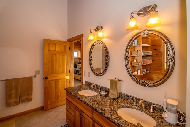 bathroom featuring tile patterned flooring and vanity