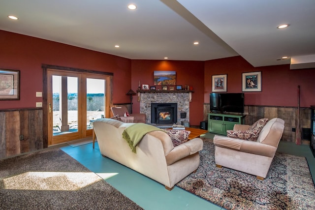 living room featuring concrete flooring and wood walls