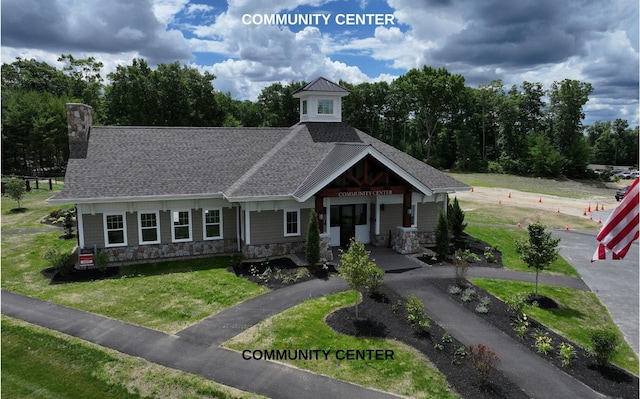 view of front of house with a porch and a front lawn