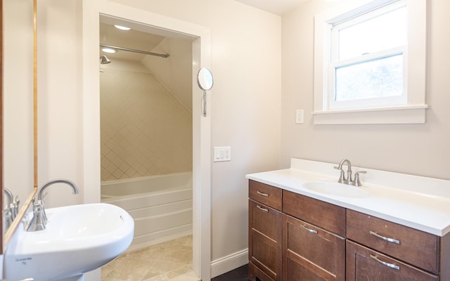 bathroom with bathing tub / shower combination and sink