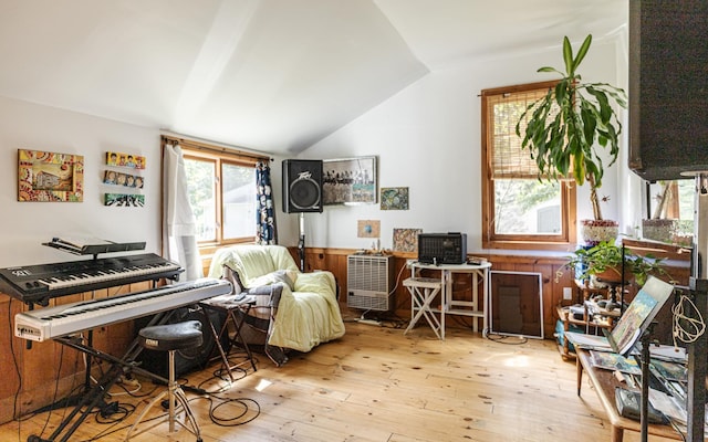 interior space featuring lofted ceiling and light wood-type flooring