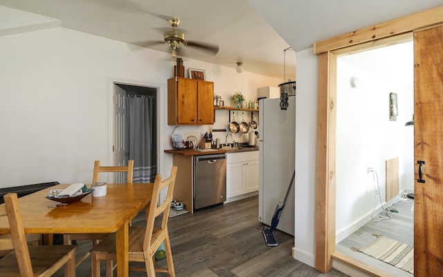 kitchen with dark hardwood / wood-style floors, dishwasher, white fridge, ceiling fan, and white cabinets