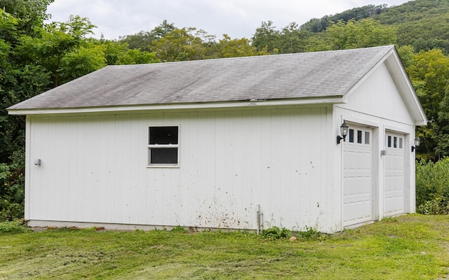 garage featuring a lawn