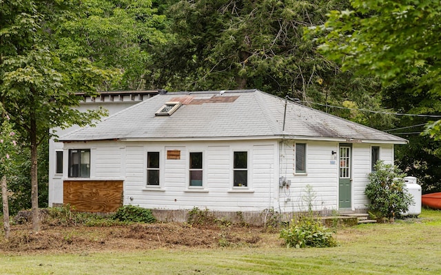 view of home's exterior with a yard