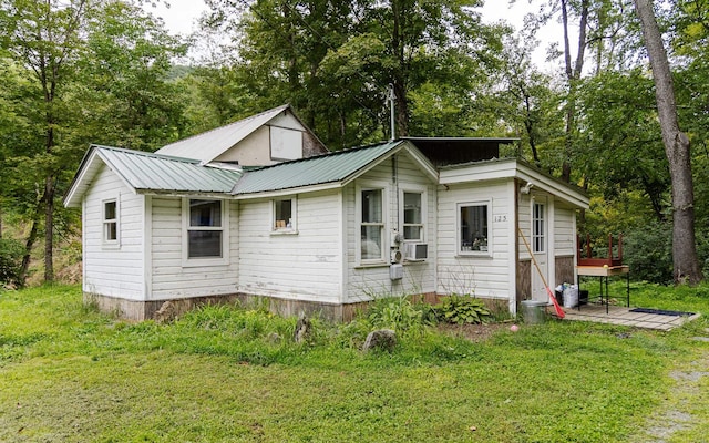 back of house with a yard