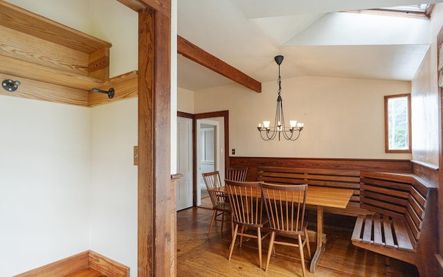 dining room featuring beam ceiling, a chandelier, and hardwood / wood-style floors