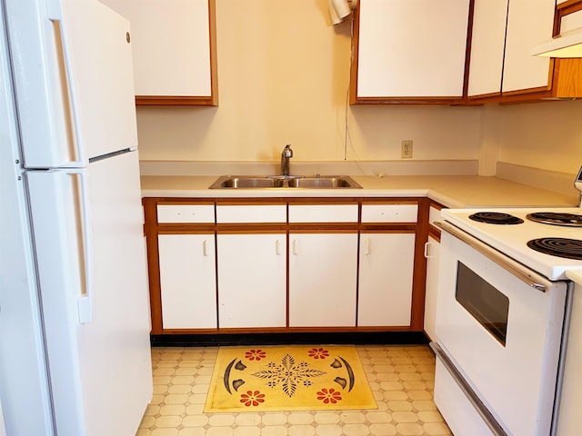 kitchen featuring white cabinetry, sink, white appliances, and range hood