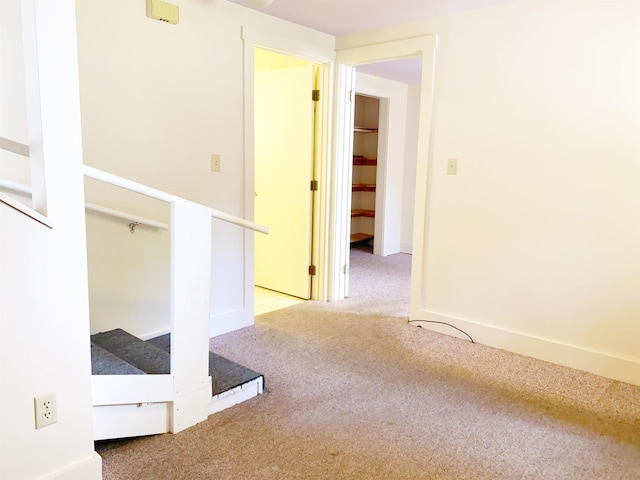 corridor featuring carpet floors